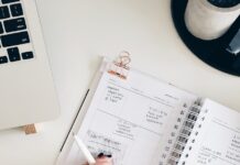 건강한 삶을 위한 일상 실천 person holding notepad and pen flat lay photography